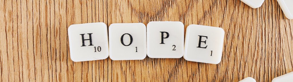 “Hope” written with scrabble tiles